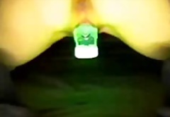 Hot chick masturbating with a glowing object in her pussy